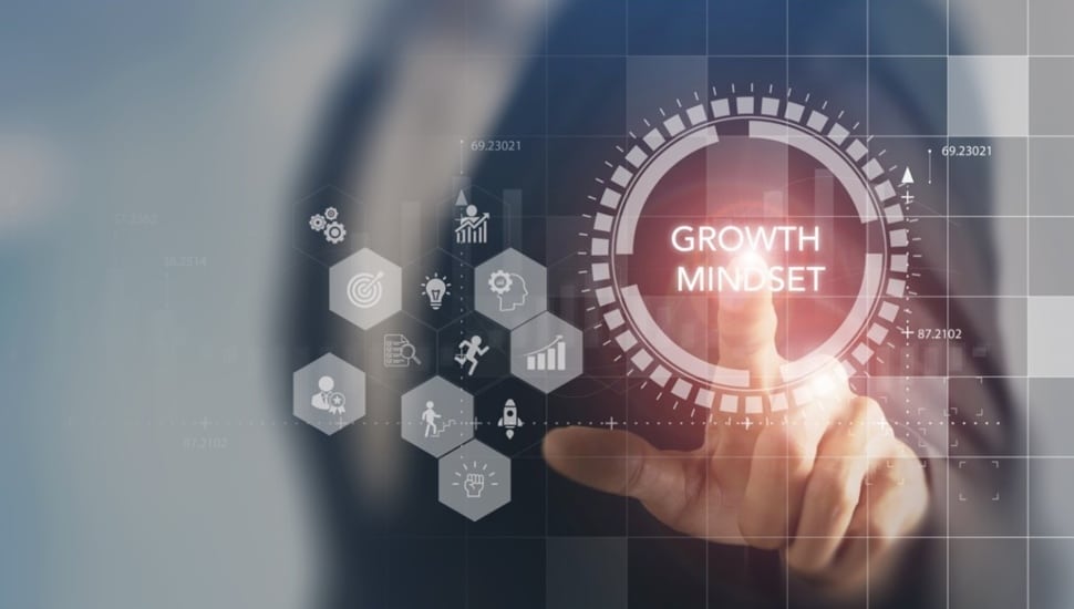 A person engages with a digital interface growth mindset concept.