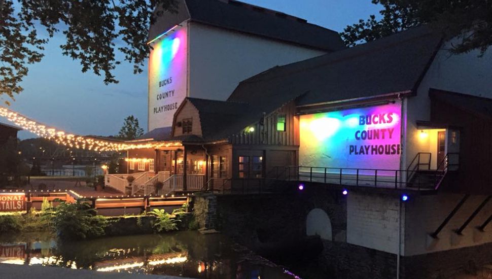 Bucks County Playhouse exterior at night with rainbow lights.