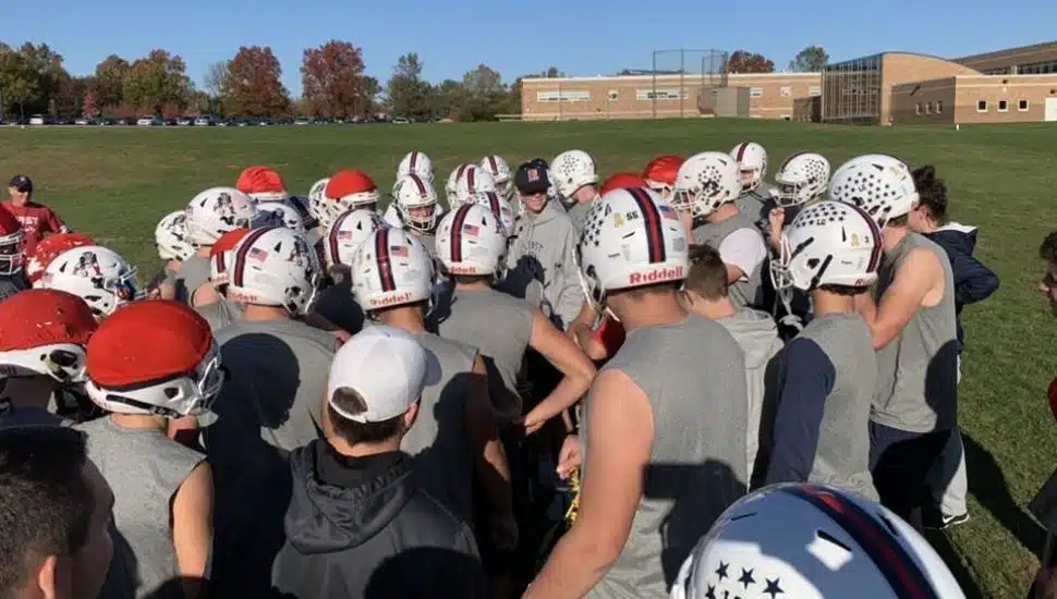 CB East Football team gathered on the field.