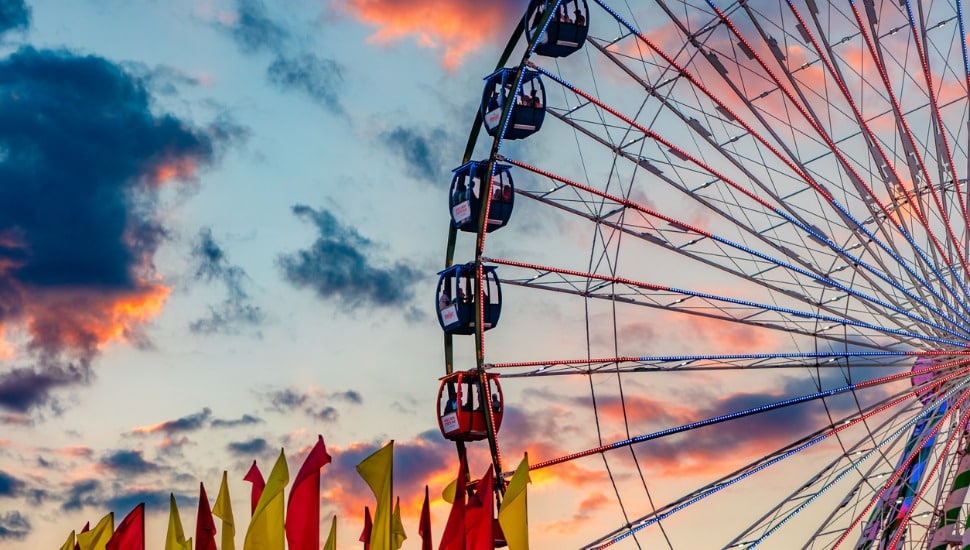 Ferris Wheel at carnival at sunset.