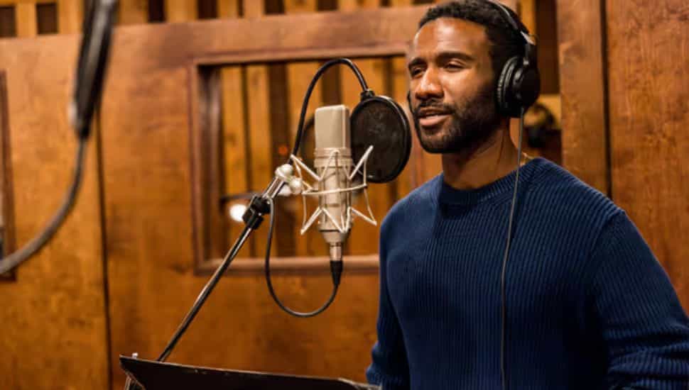 Clyde Voce in a recording booth.