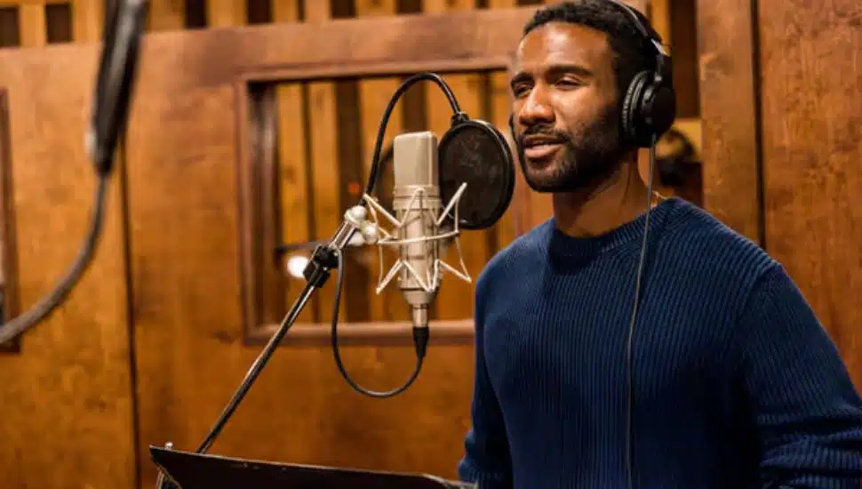 Clyde Voce in a recording booth.