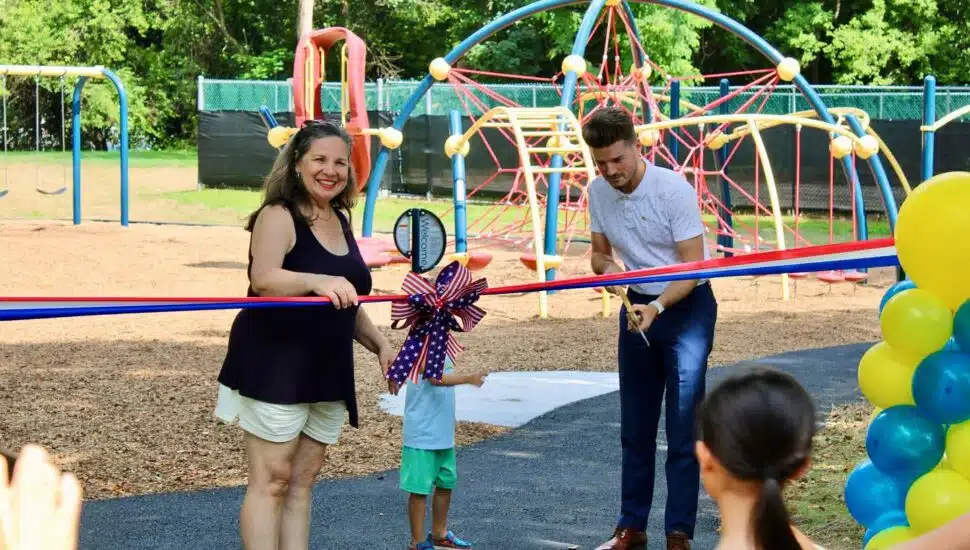 Helen Hlahol with locals at the ribbon-cutting ceremony to open Manor Park Playground.