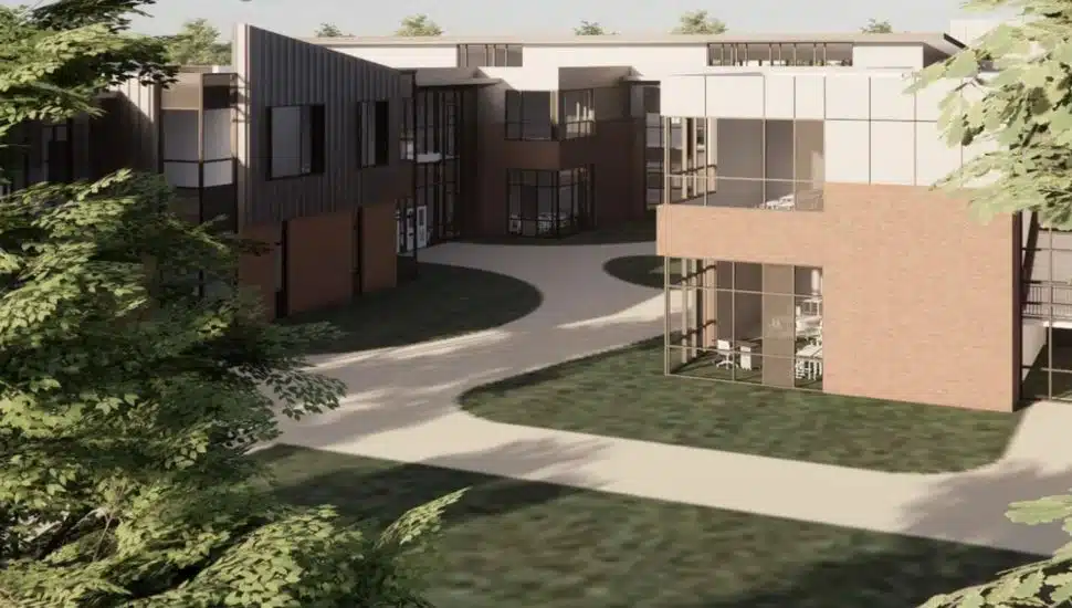 Digital rendering of new school featuring a large walkway and buildings.