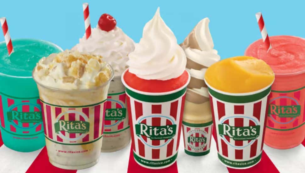 A cup of Rita's water ice, a gelati, a blendini, an ice cream, and milkshakes in a line on a table.
