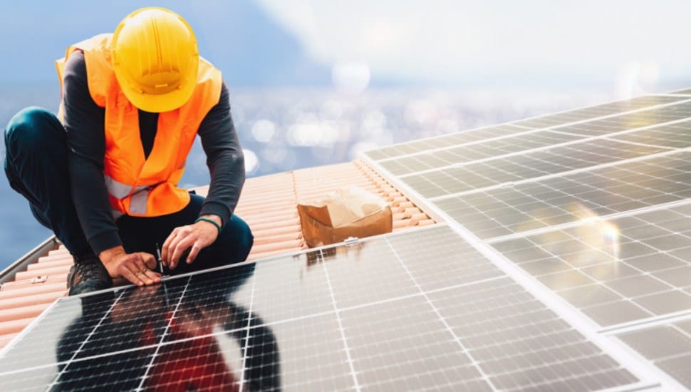 Man installing solar panels.