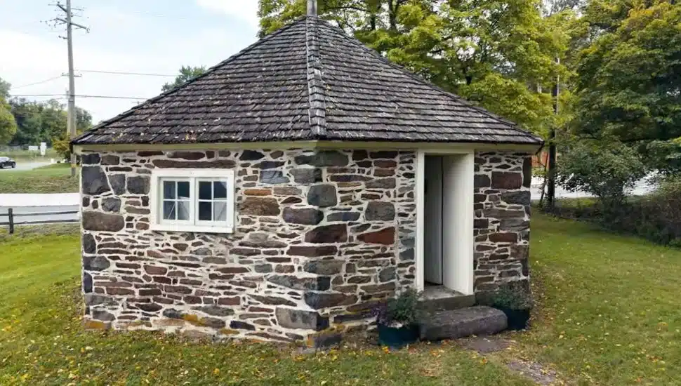 Stone, octagonal schoolhouse.