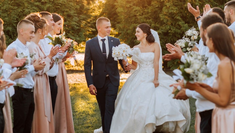 Bride and Groom walking down aisle.