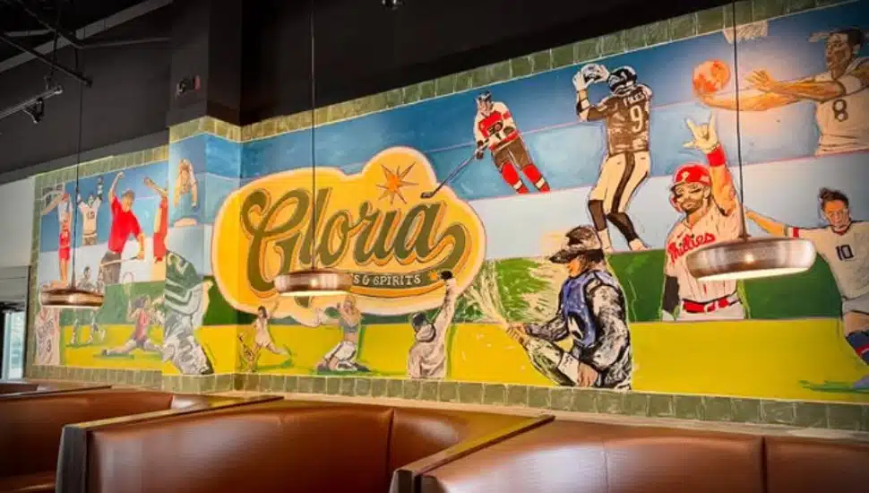 Wall art of Philadelphia athletes at Gloria Spots & Spirits.