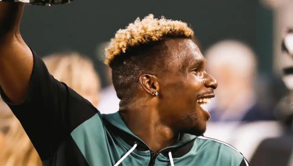 James LeGette smiling while cheering.