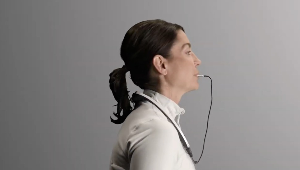 Woman using PoNS Device.