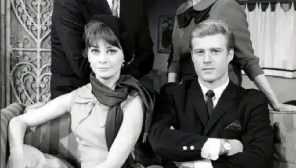 Robert Redford and Elizabeth Ashley sitting beside each other.