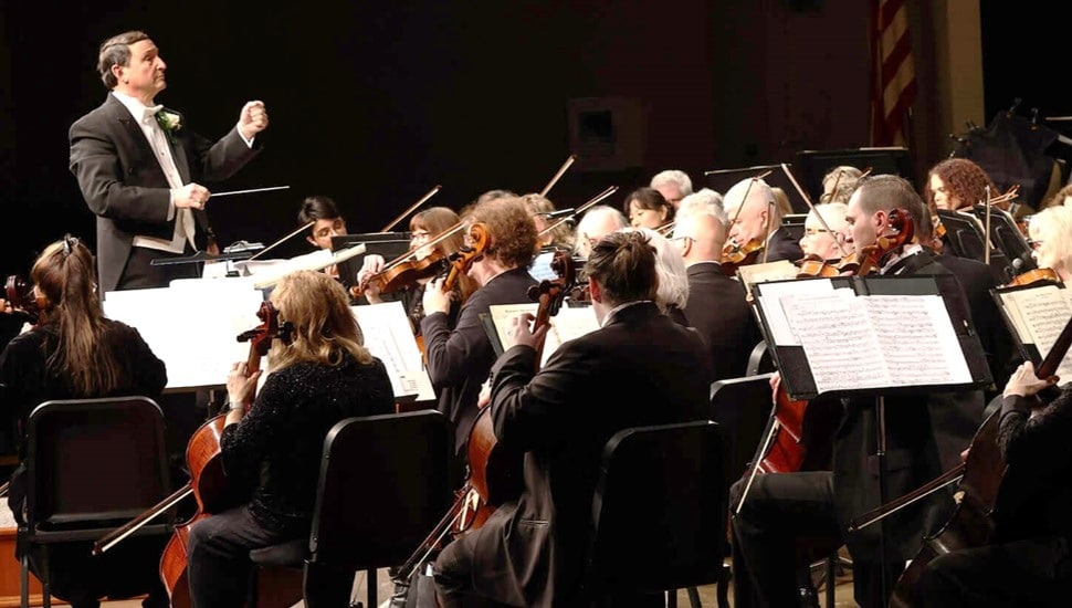 Orchestra performs music.