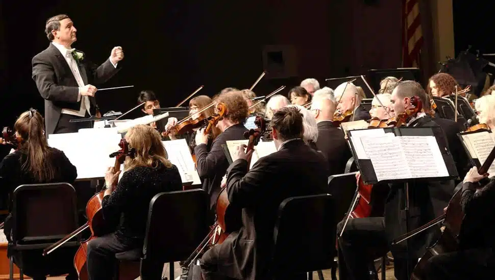 Orchestra performs music.