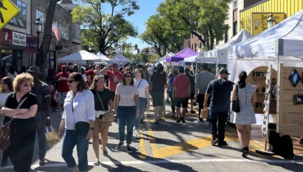 People walking between vendors.