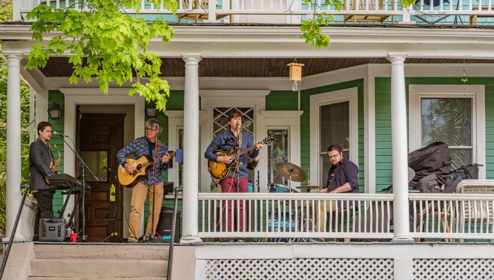 Band playing on a porch.