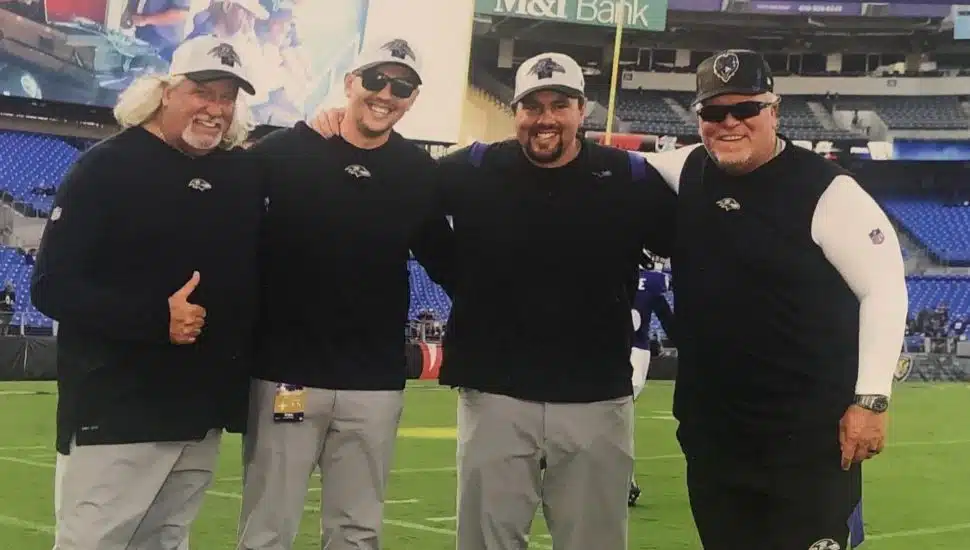 Kevin Wilkins and Drew Wilkins with Rob Ryan and Wink Martindale.
