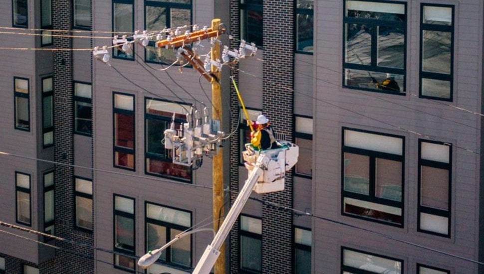 Utility worker restores electricity.