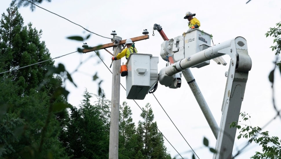 Utility worker works on electrical lines.