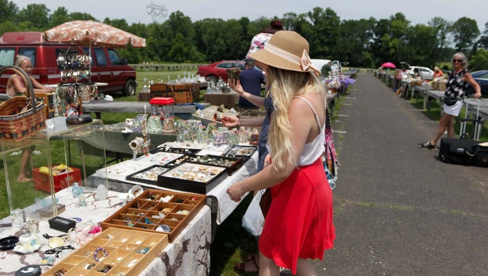 Woman looking at vendor's table at Rice's Market.
