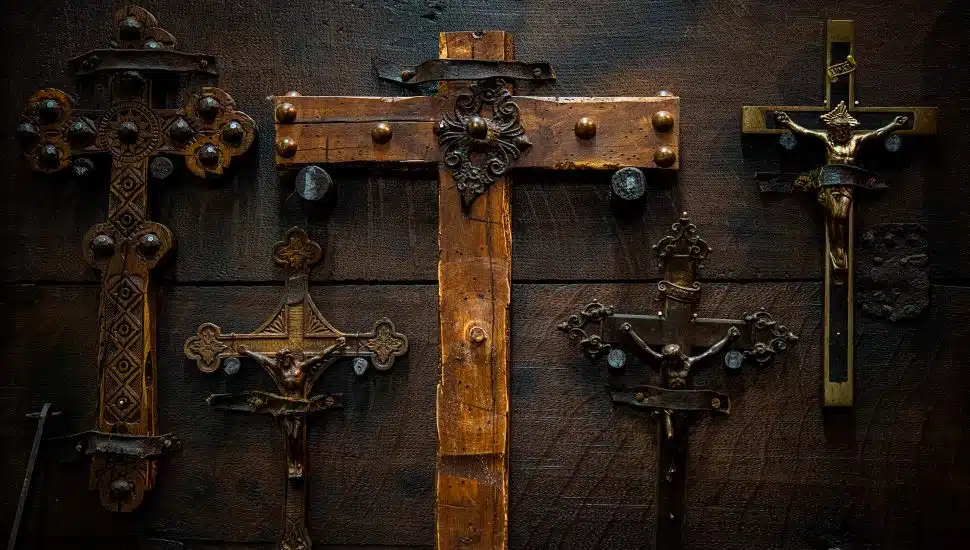 Crucifixes hanging on a wall.