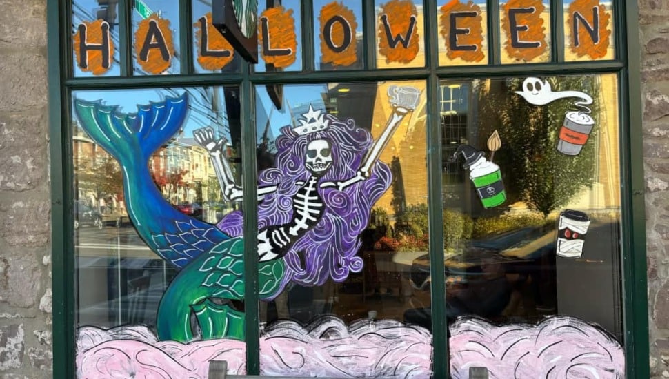 Skeleton mermaid window painting at Starbucks.
