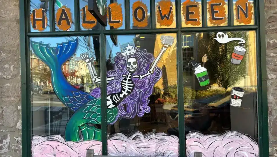 Skeleton mermaid window painting at Starbucks.