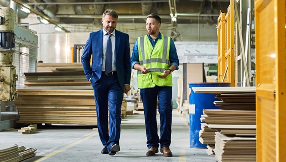 Shop worker talks with his financial advisor.