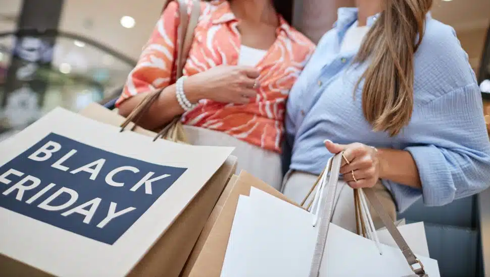 Black Friday shoppers with bags.
