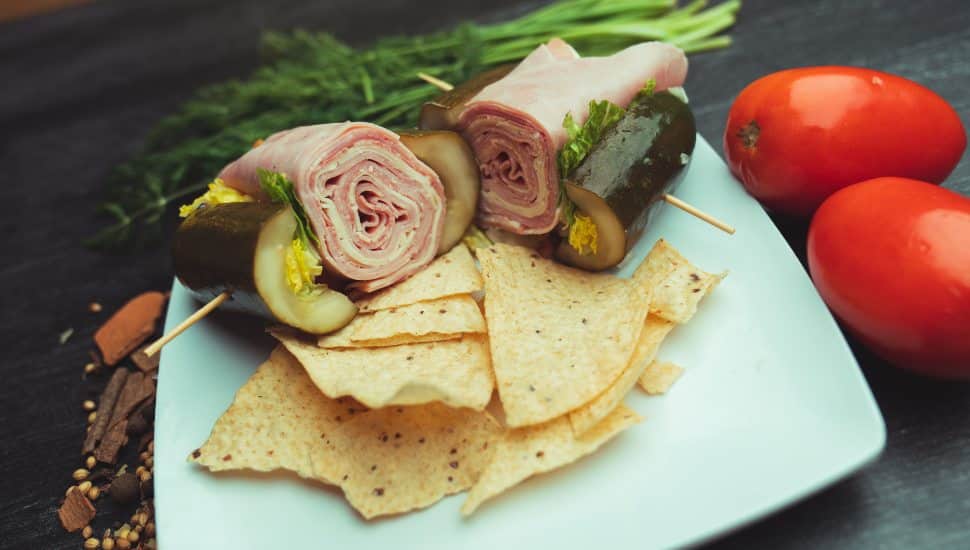 Pickle hoagie with chips.