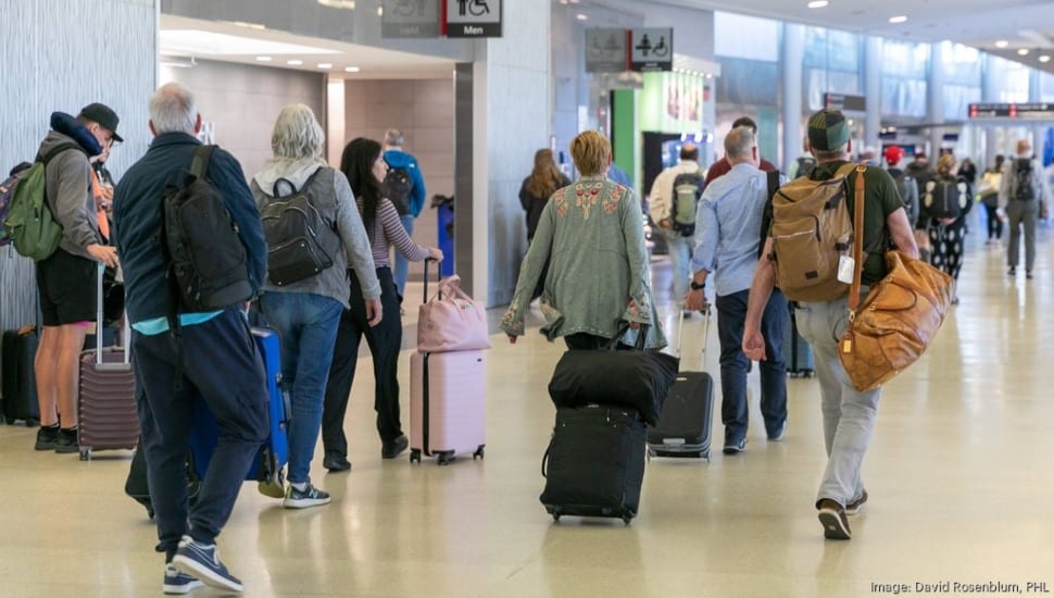 Passengers wait in line at Philadelphia International Airport.