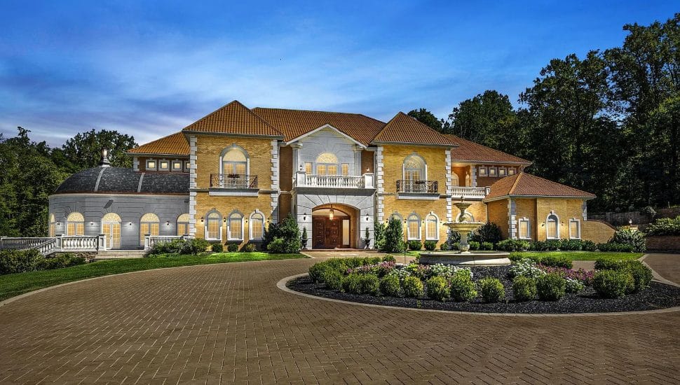 Large stone estate with a stone roundabout.