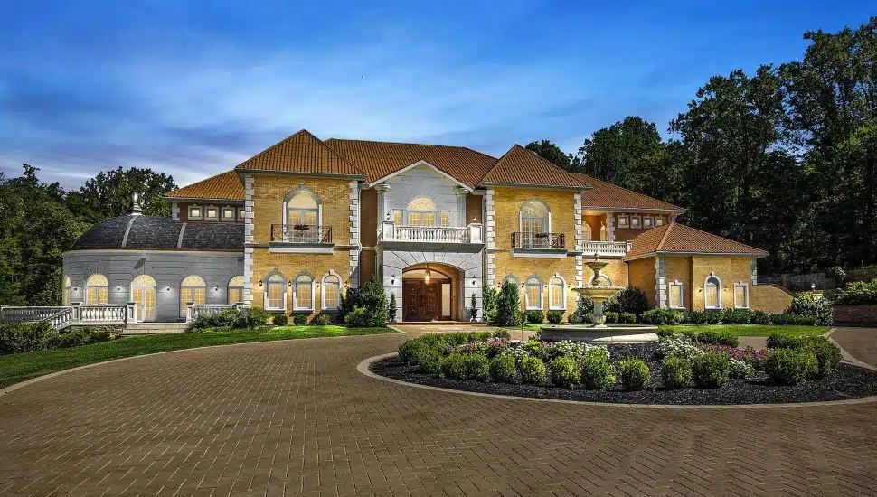 Large stone estate with a stone roundabout.