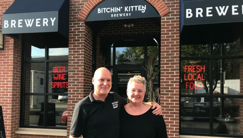 Bitchin’ Kitten Brewery owners standing out front of building.