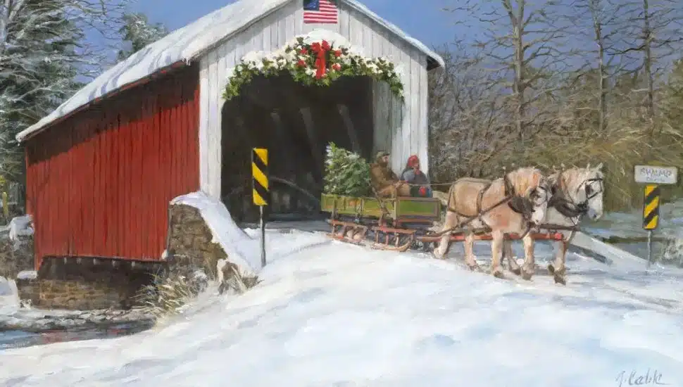 Painting of two people on horse-drawn bobsled with Christmas tree, crossing the Erwinna Covered Bridge.