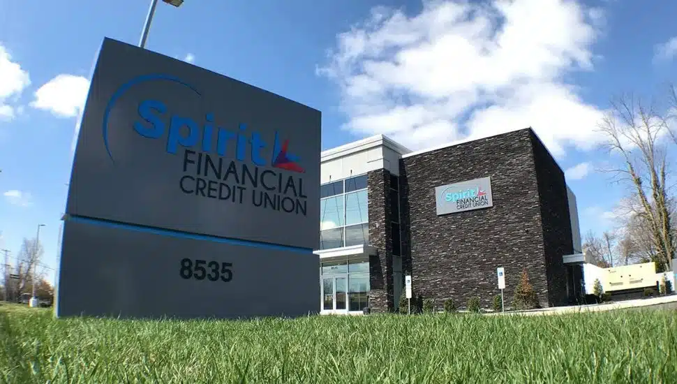 Spirit Financial Credit Union sign and building in background.