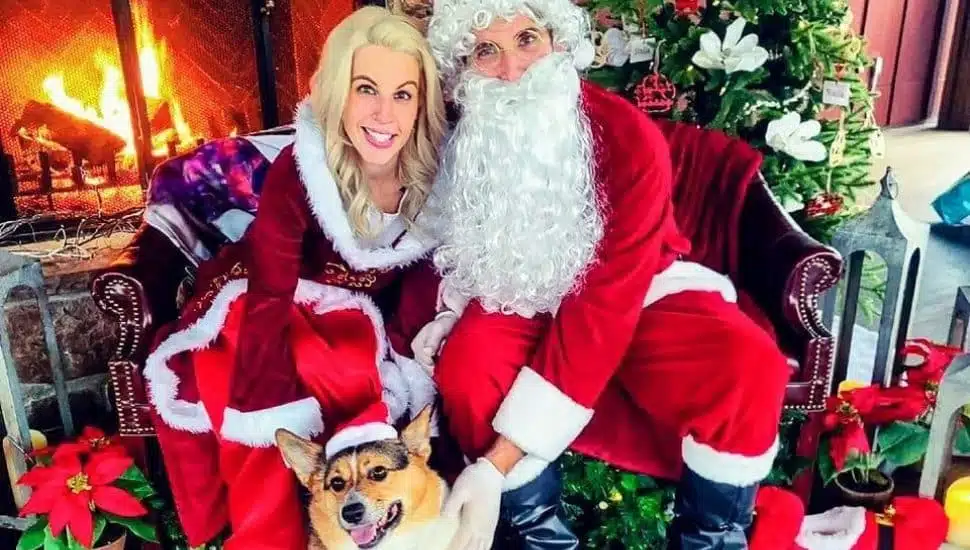 Mr. and Mrs. Clause with corgi on Stella's patio.