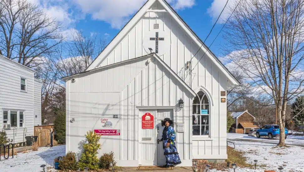 Shirley Lee Corsey in front of Gather Place Museum.
