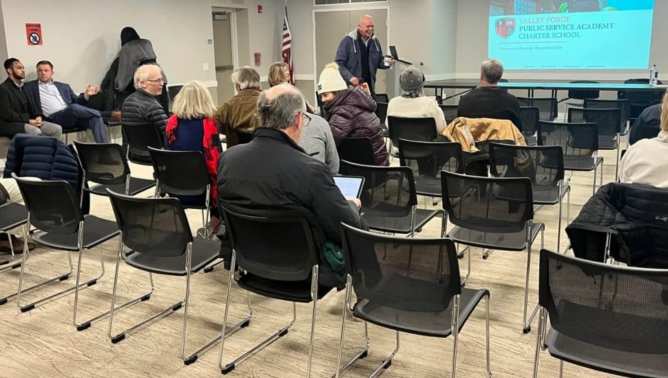 Members of the community watch a presentation on a proposed Valley Forge Public Service Academy Charter School.