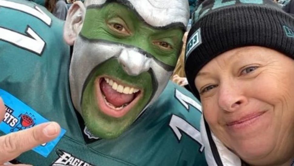 Mary Kate Mink takes a selfie with Eagles superfan Jamie Pagliei .