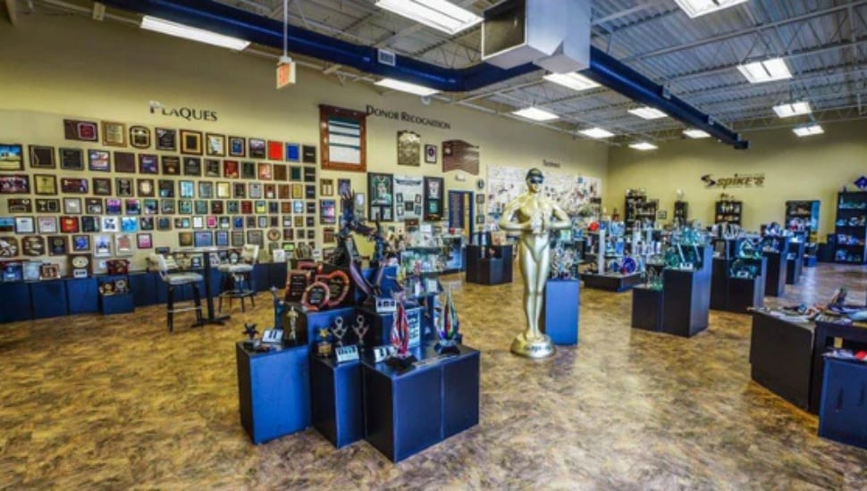 Inisde Spike's, with various plaques, trophies, medals, and more.