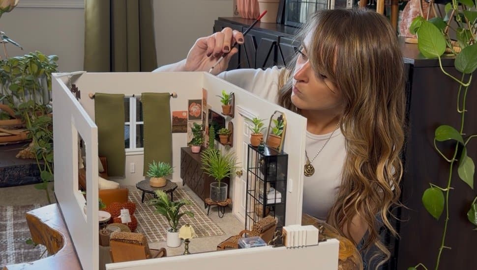 Kylie Working on living room miniature.