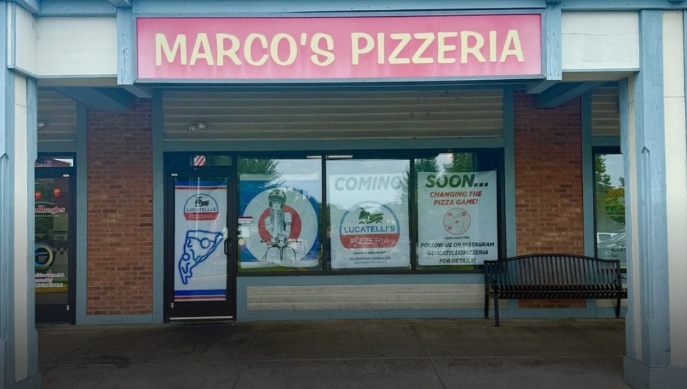 Former Marcos' Pizzeria in Newtown with Lucatelli's signs in the windows.