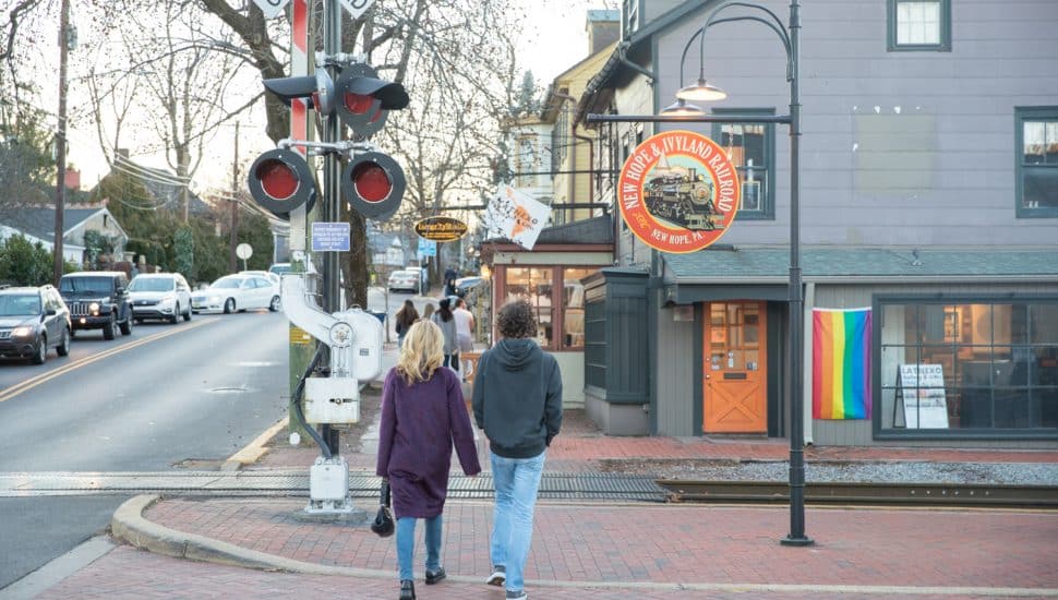 Couple walking down the street in New Hope.