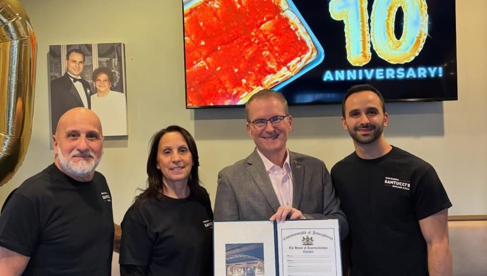Owners of Philomena Santucci's Square Pizza with Rep. Brian Munroe.