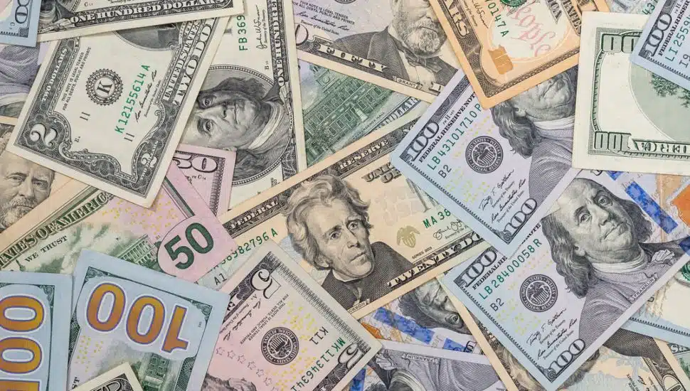 Background of different paper dollar bills.