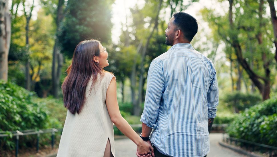 Couple holding hands.