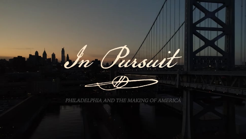 "In Pursuit: Philadelphia and the Making of America" written with shot of the Ben Franklin Bridge in the background.