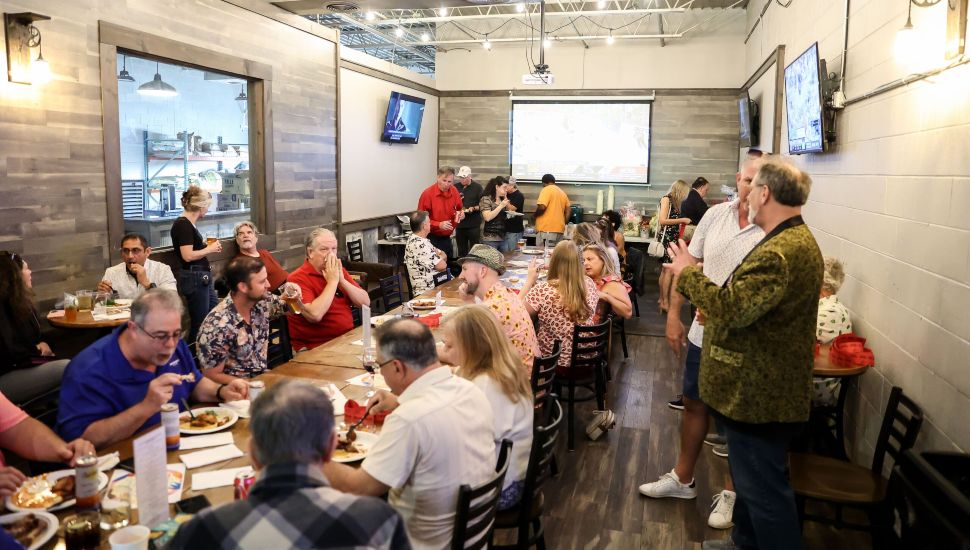 People gathered at LEV27 fundraising event.