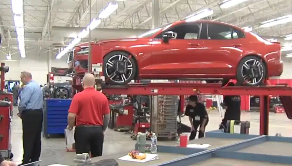 Students inspect a new car at the Greater Philadelphia Auto Technology Competition.